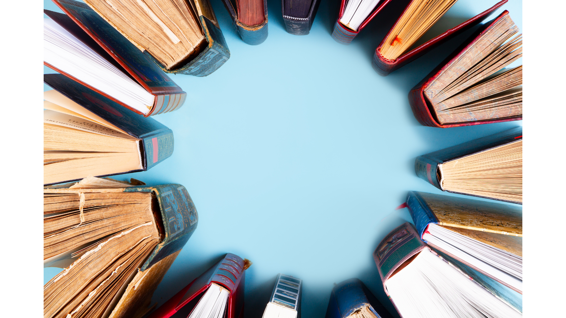 Vintage books arranged around a soft blue center